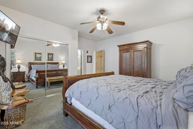 a bed room with a bed and a chandelier