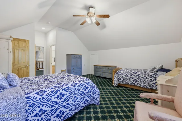 a bathroom with a sink a toilet and shower curtain