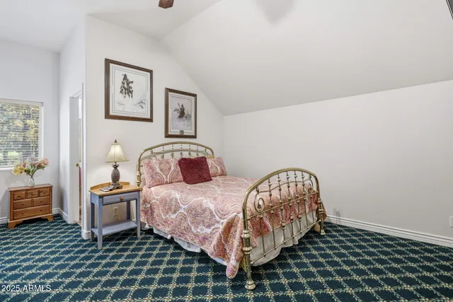 a bedroom with a bed and a table