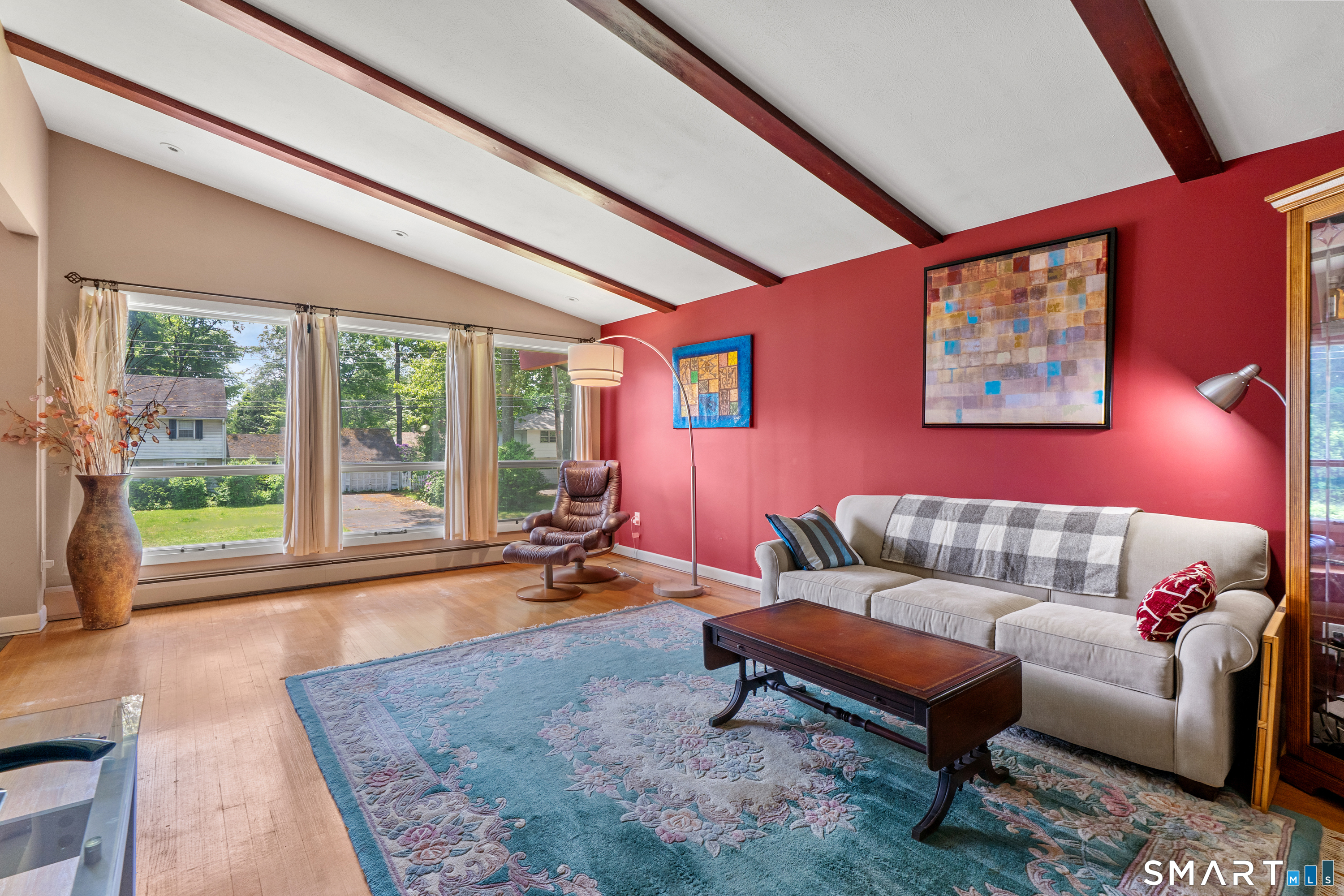 107 Round Hill Road Wethersfield, CT 06109 - Photo 8 of 40 a living room with furniture a rug and a large window