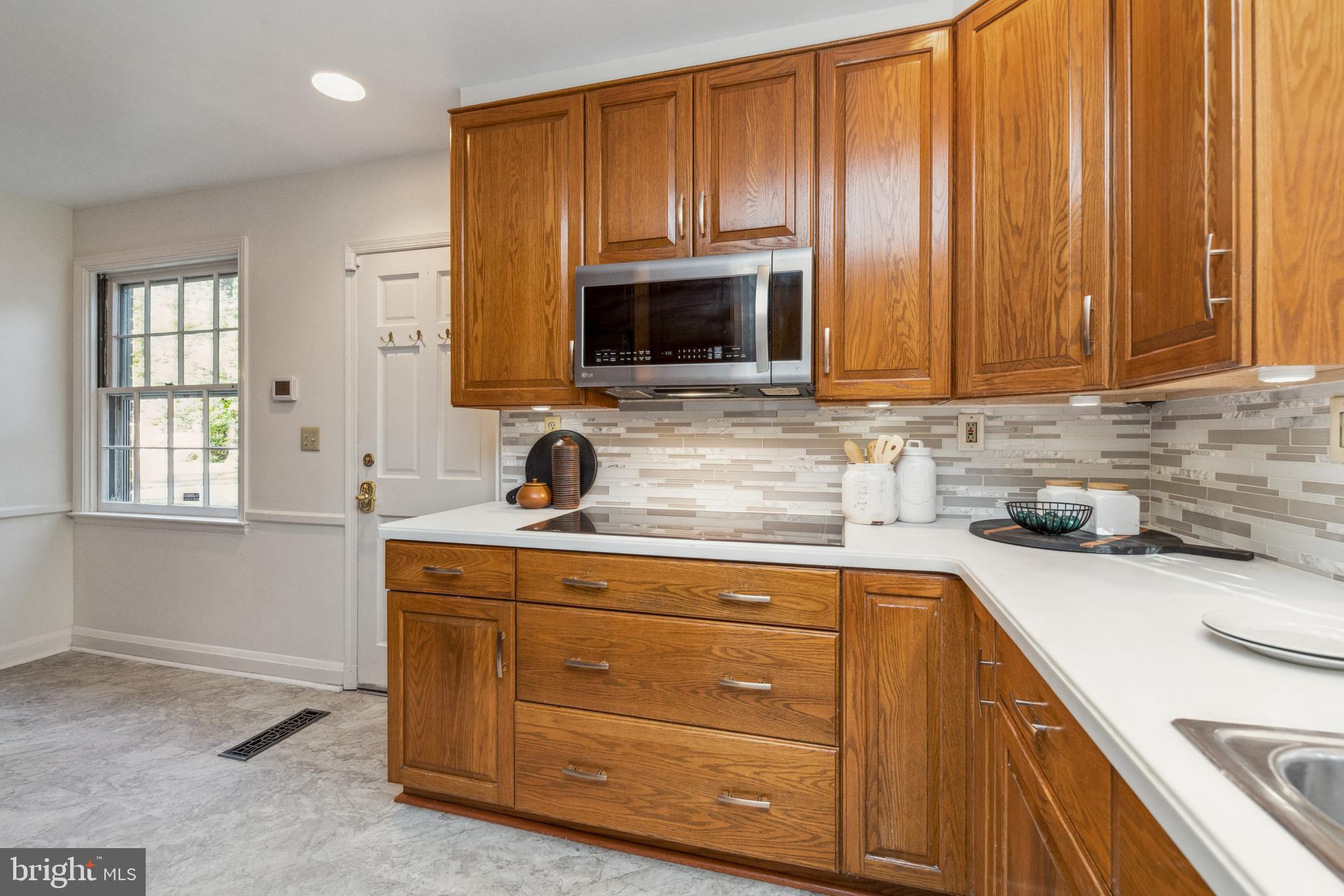 203 Churchwardens Road Baltimore, MD 21212 - Photo 13 of 48 Kitchen with newly installed backsplash & flooring