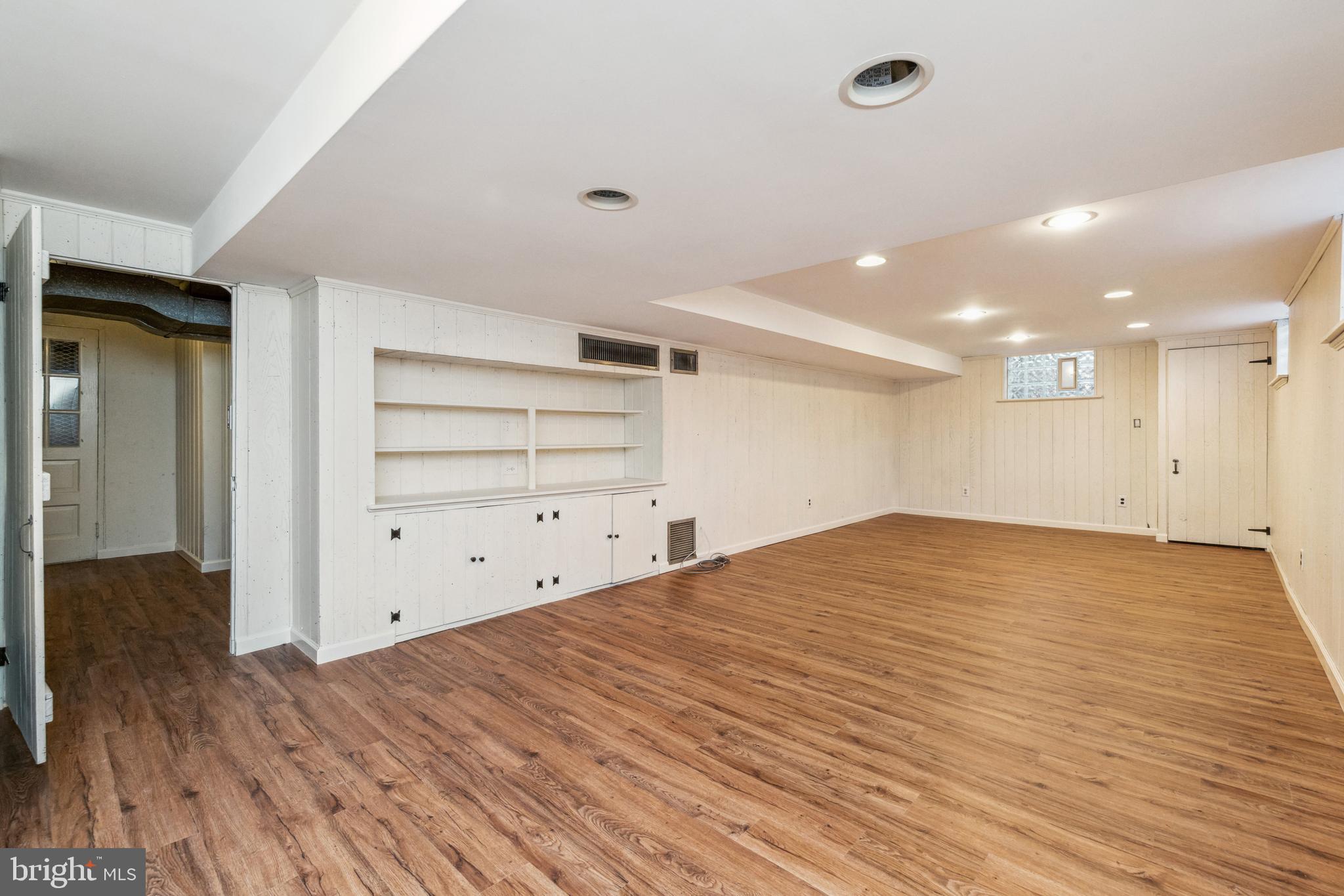 203 Churchwardens Road Baltimore, MD 21212 - Photo 31 of 48 Lower Level Rec Room with New Vinyl Flooring