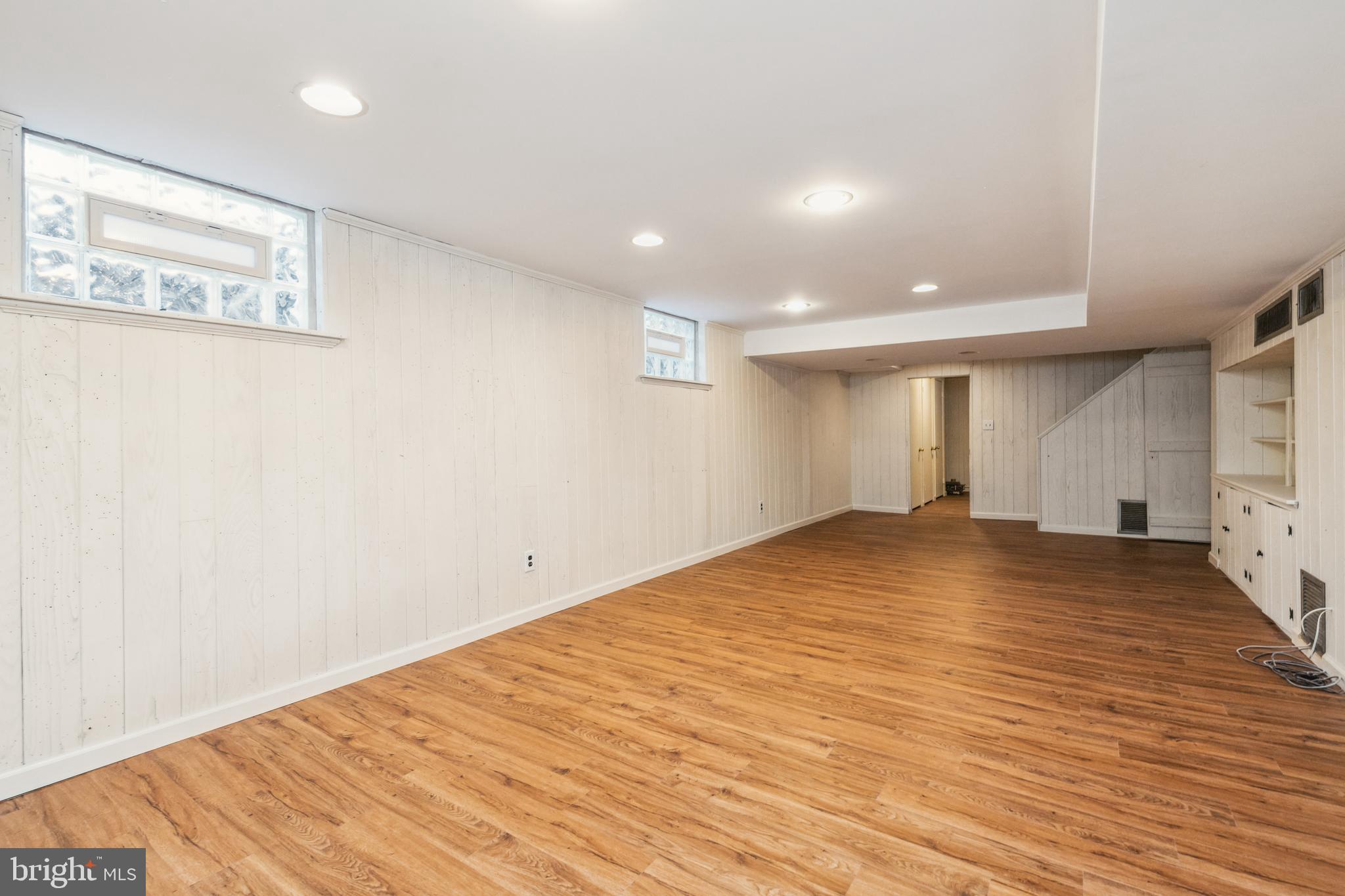 203 Churchwardens Road Baltimore, MD 21212 - Photo 33 of 48 Lower Level Rec Room with New Vinyl Flooring