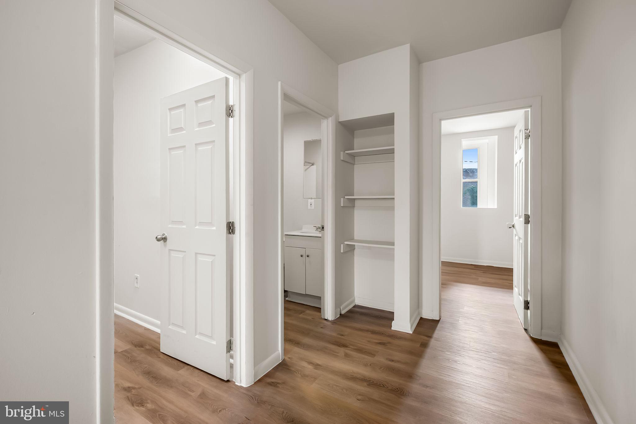 3021 Belair Road Baltimore, MD 21213 - Photo 14 of 27 a view of a hallway with wooden floor