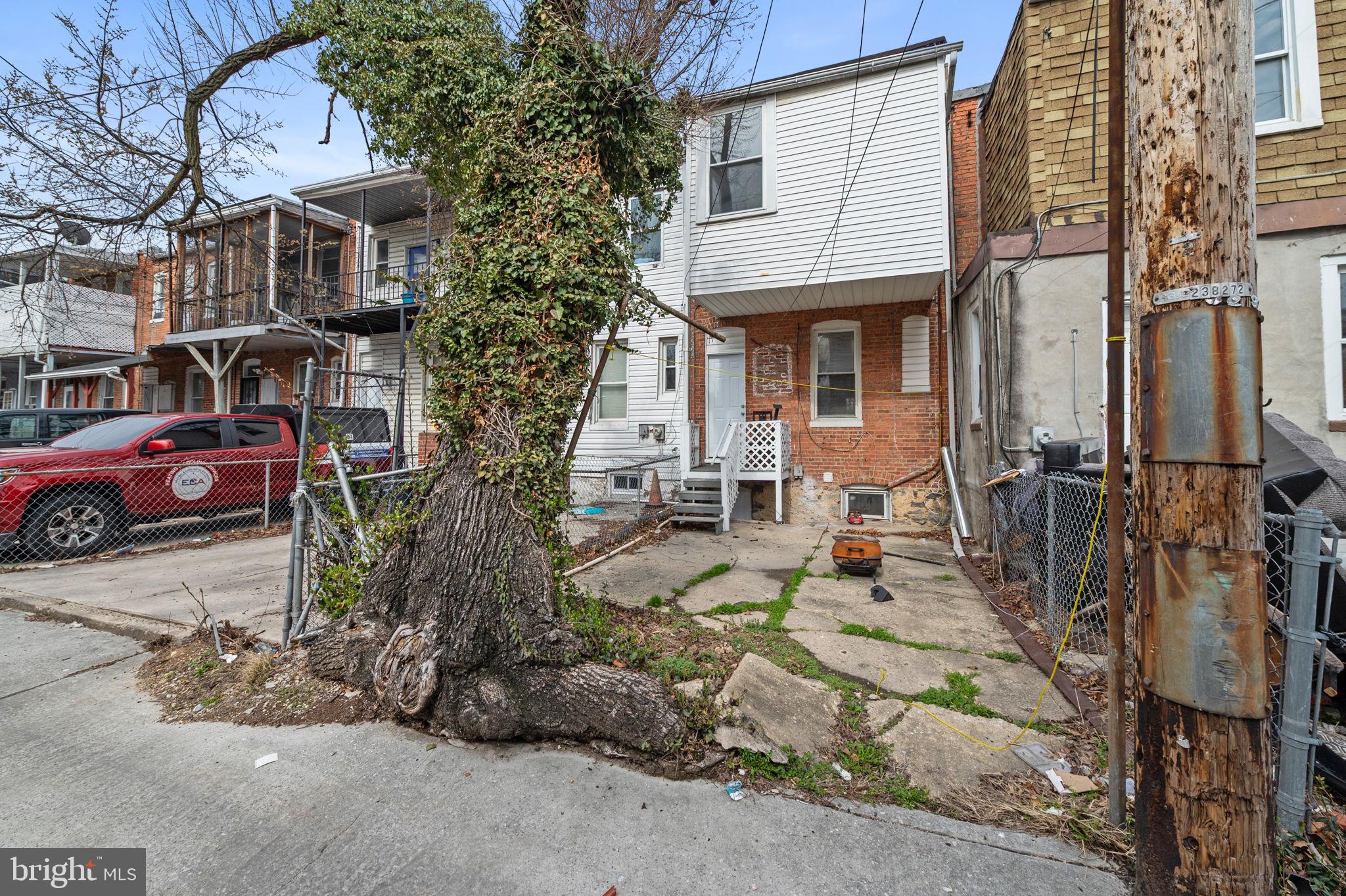 3021 Belair Road Baltimore, MD 21213 - Photo 27 of 27 a view of a house with a cars park side of a road