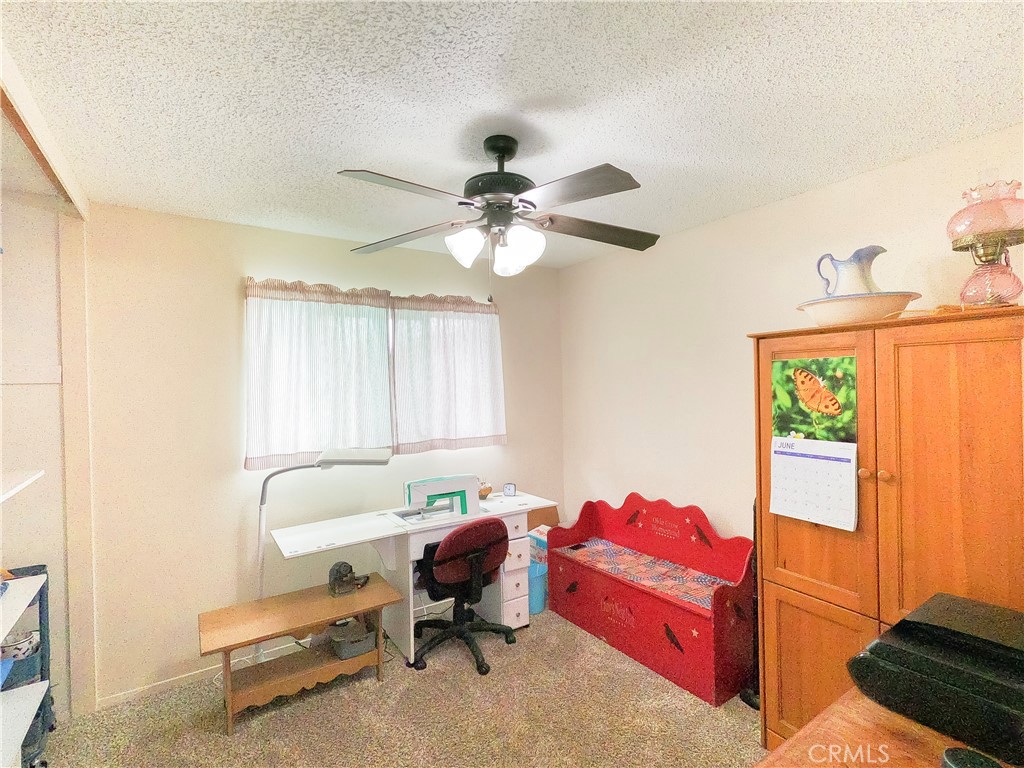 4757 Dundee Road Riverside, CA 92503 - Photo 18 of 26 a living room with furniture and a window