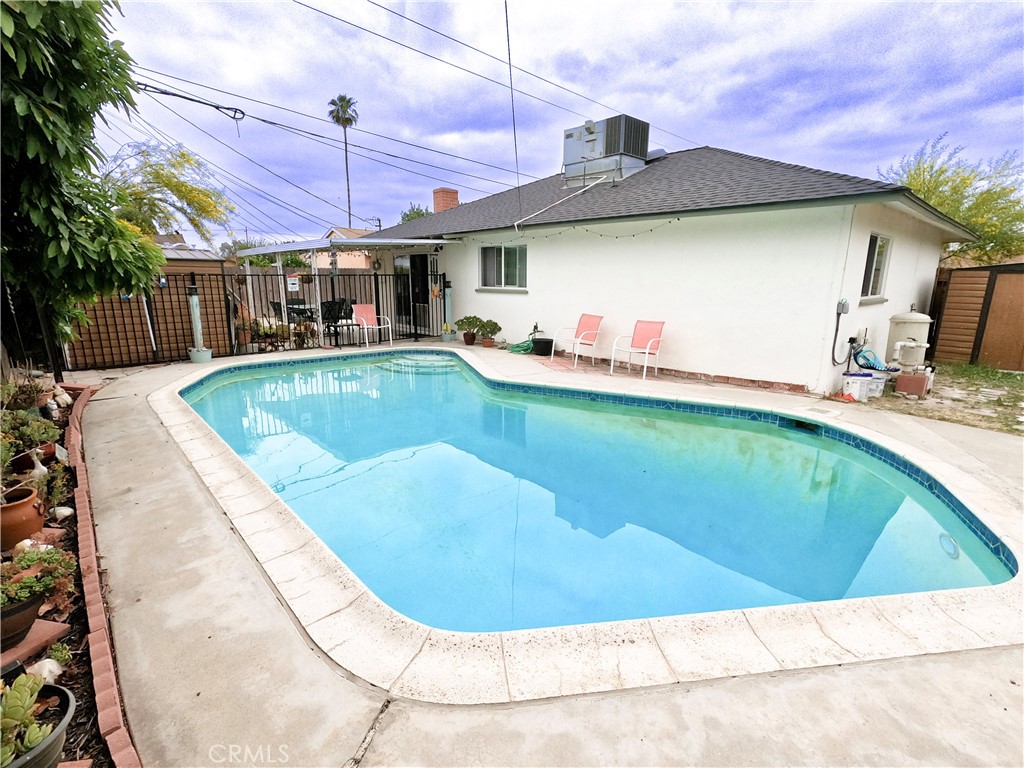 4757 Dundee Road Riverside, CA 92503 - Photo 2 of 26 a view of a house with swimming pool