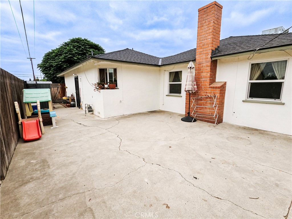 4757 Dundee Road Riverside, CA 92503 - Photo 22 of 26 a view of a house with backyard and utility