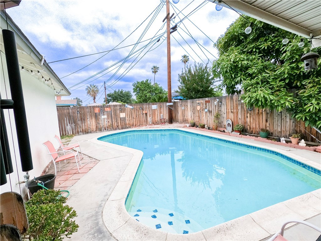 4757 Dundee Road Riverside, CA 92503 - Photo 4 of 26 a view of a backyard with potted plants