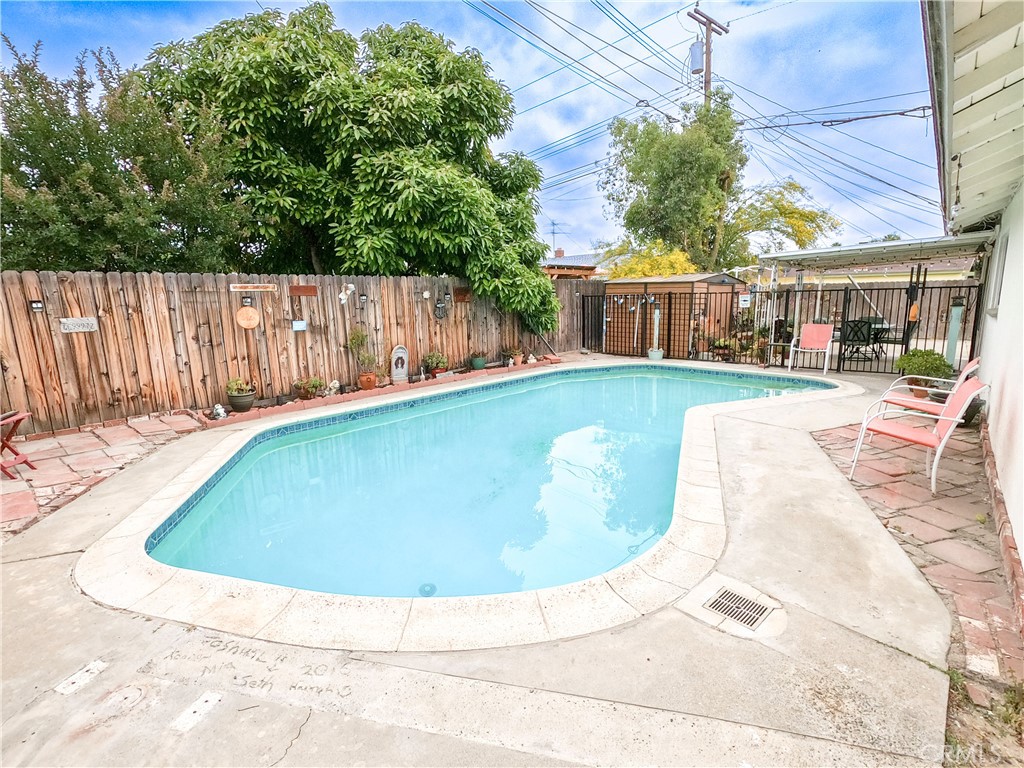 4757 Dundee Road Riverside, CA 92503 - Photo 5 of 26 a view of a swimming pool with a patio