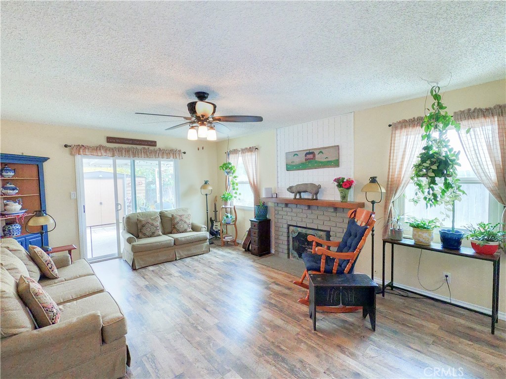 4757 Dundee Road Riverside, CA 92503 - Photo 7 of 26 a living room with furniture and a large window