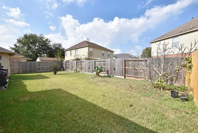 a view of a house with a big yard