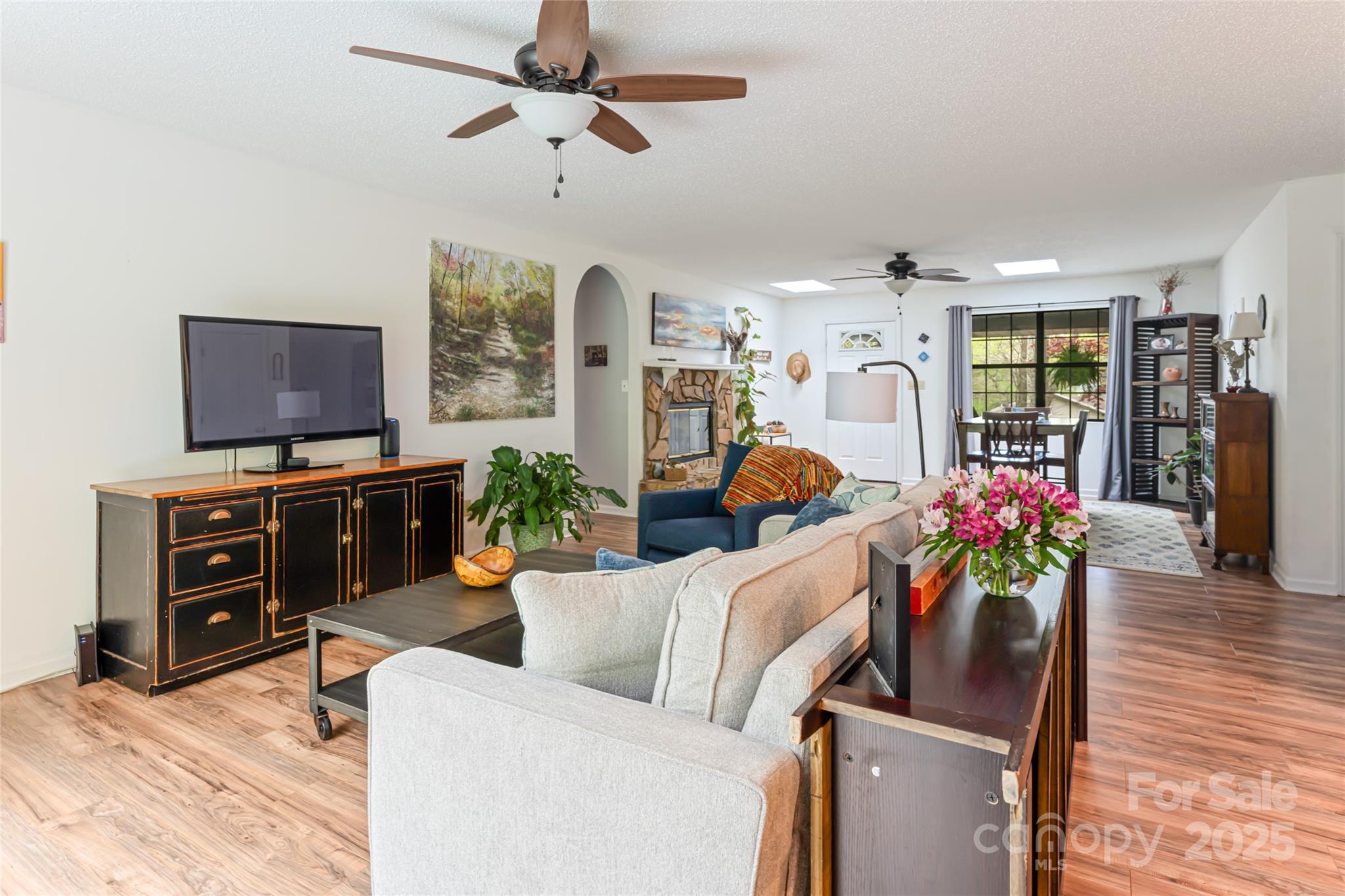 21 Mann Road Asheville, NC 28805 - Photo 11 of 36 a living room with furniture and a flat screen tv
