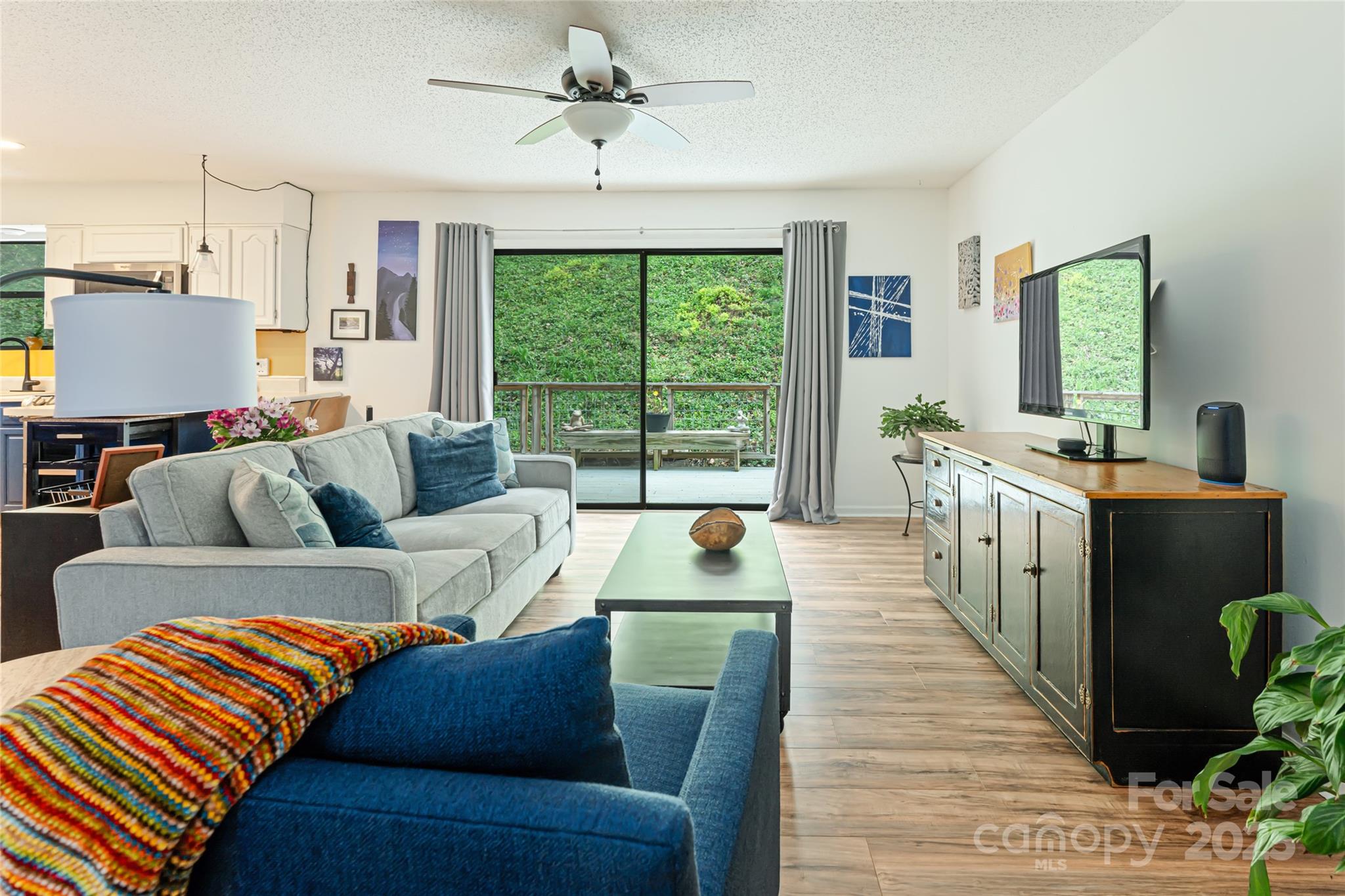 21 Mann Road Asheville, NC 28805 - Photo 12 of 36 a living room with furniture and a large window