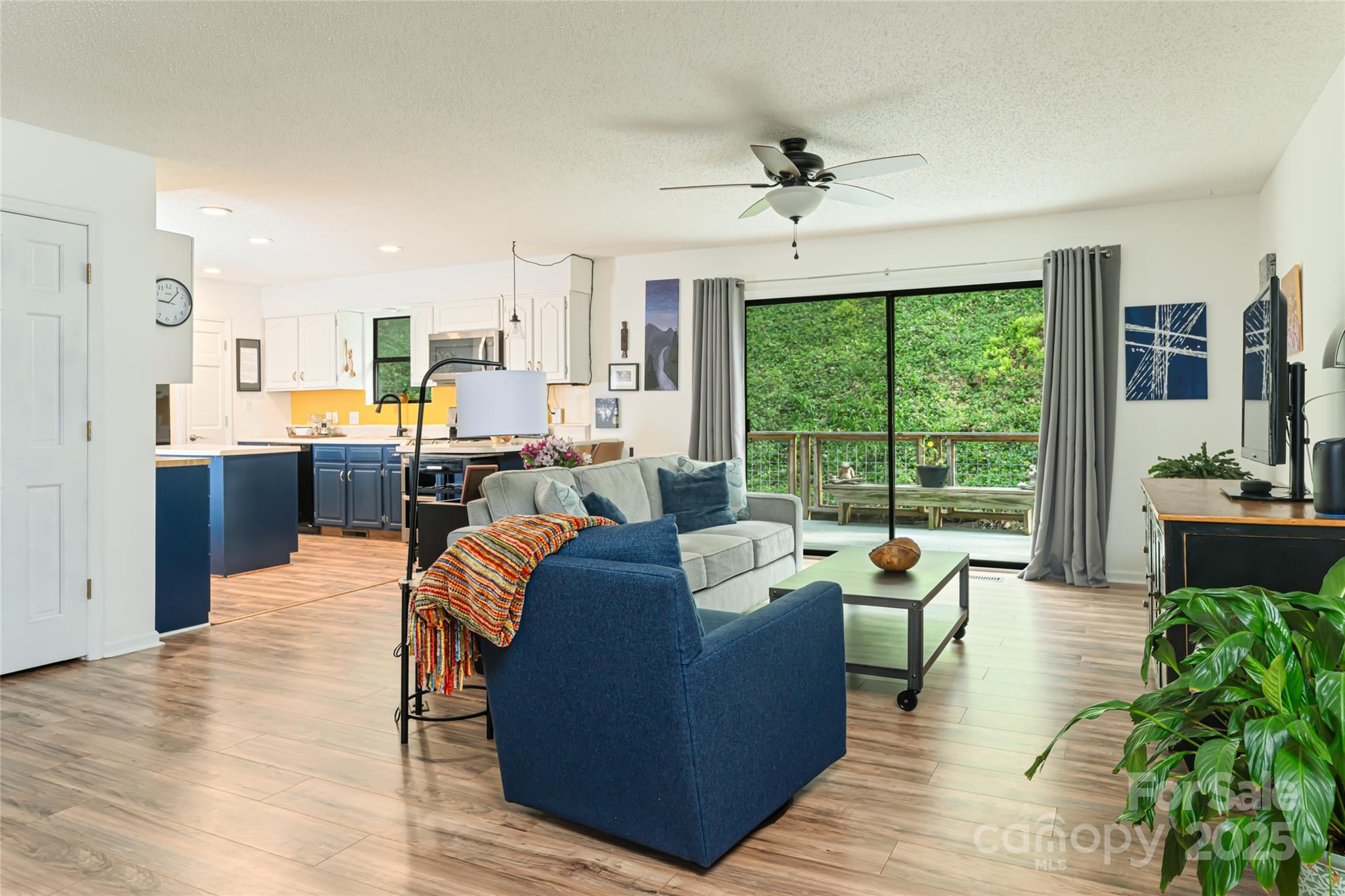 21 Mann Road Asheville, NC 28805 - Photo 13 of 36 a living room with furniture and a large window