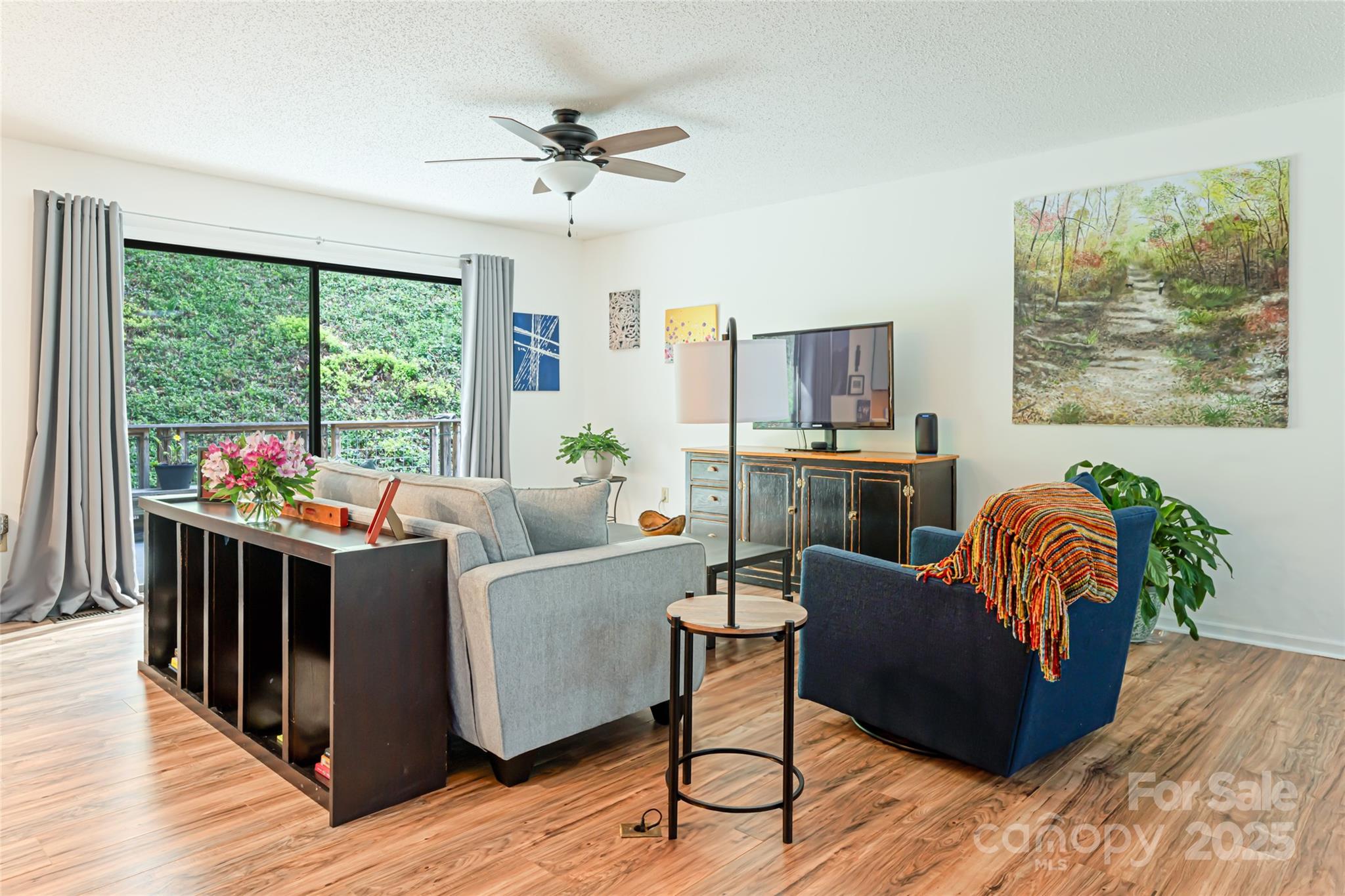 21 Mann Road Asheville, NC 28805 - Photo 14 of 36 a living room with furniture and a large window
