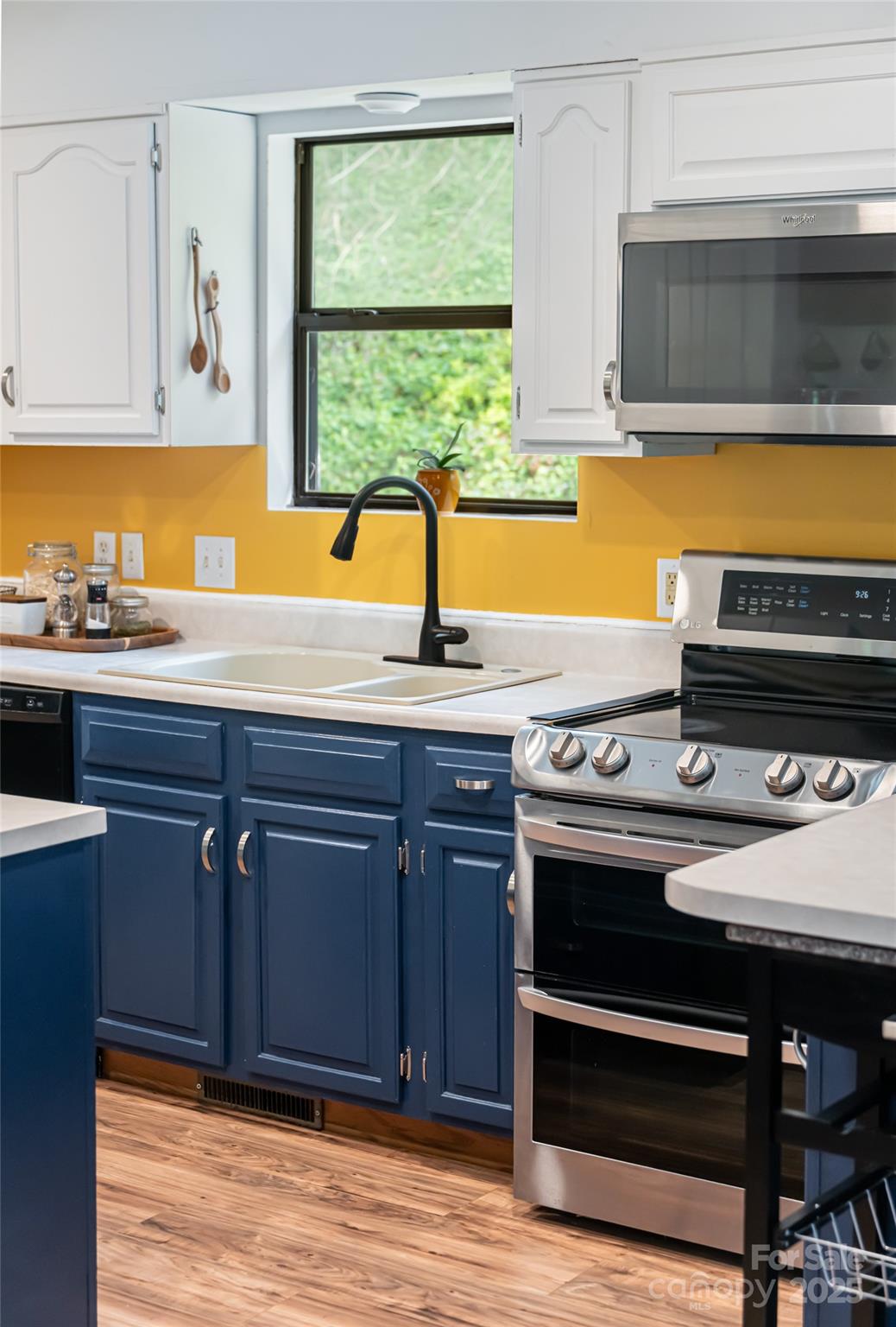 21 Mann Road Asheville, NC 28805 - Photo 18 of 36 a kitchen with a stove and a sink