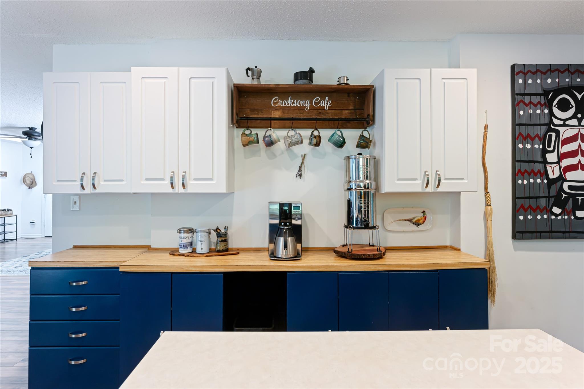 21 Mann Road Asheville, NC 28805 - Photo 19 of 36 a kitchen with stainless steel appliances granite countertop a sink stove and cabinets