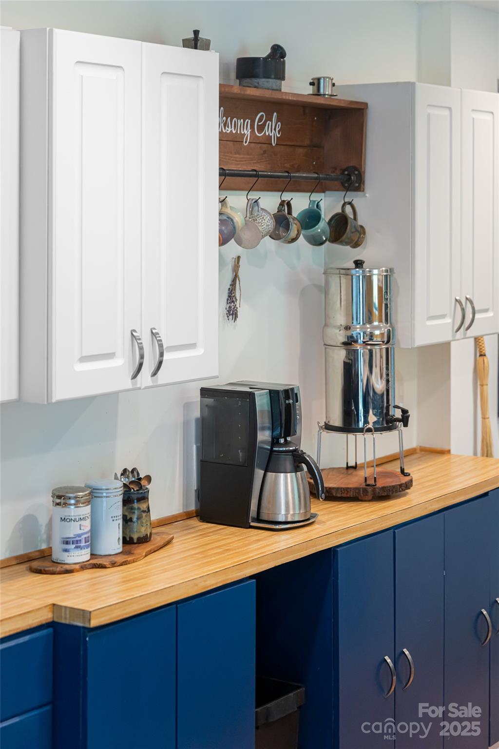 21 Mann Road Asheville, NC 28805 - Photo 20 of 36 a kitchen with stainless steel appliances a sink and cabinets