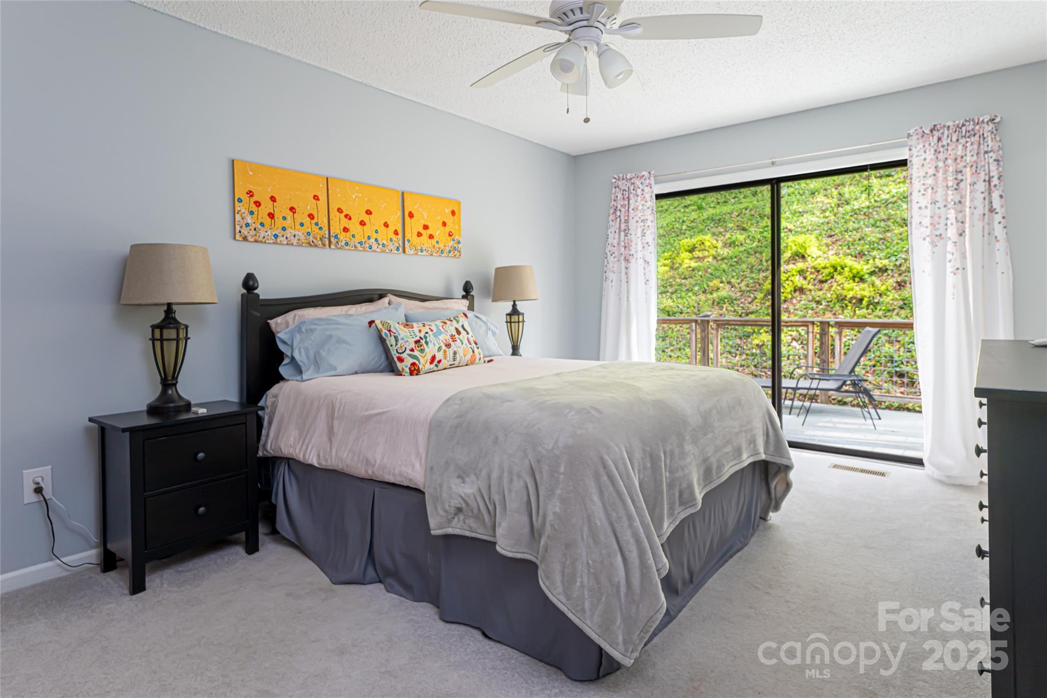 21 Mann Road Asheville, NC 28805 - Photo 23 of 36 a bed sitting in a bedroom next to a window
