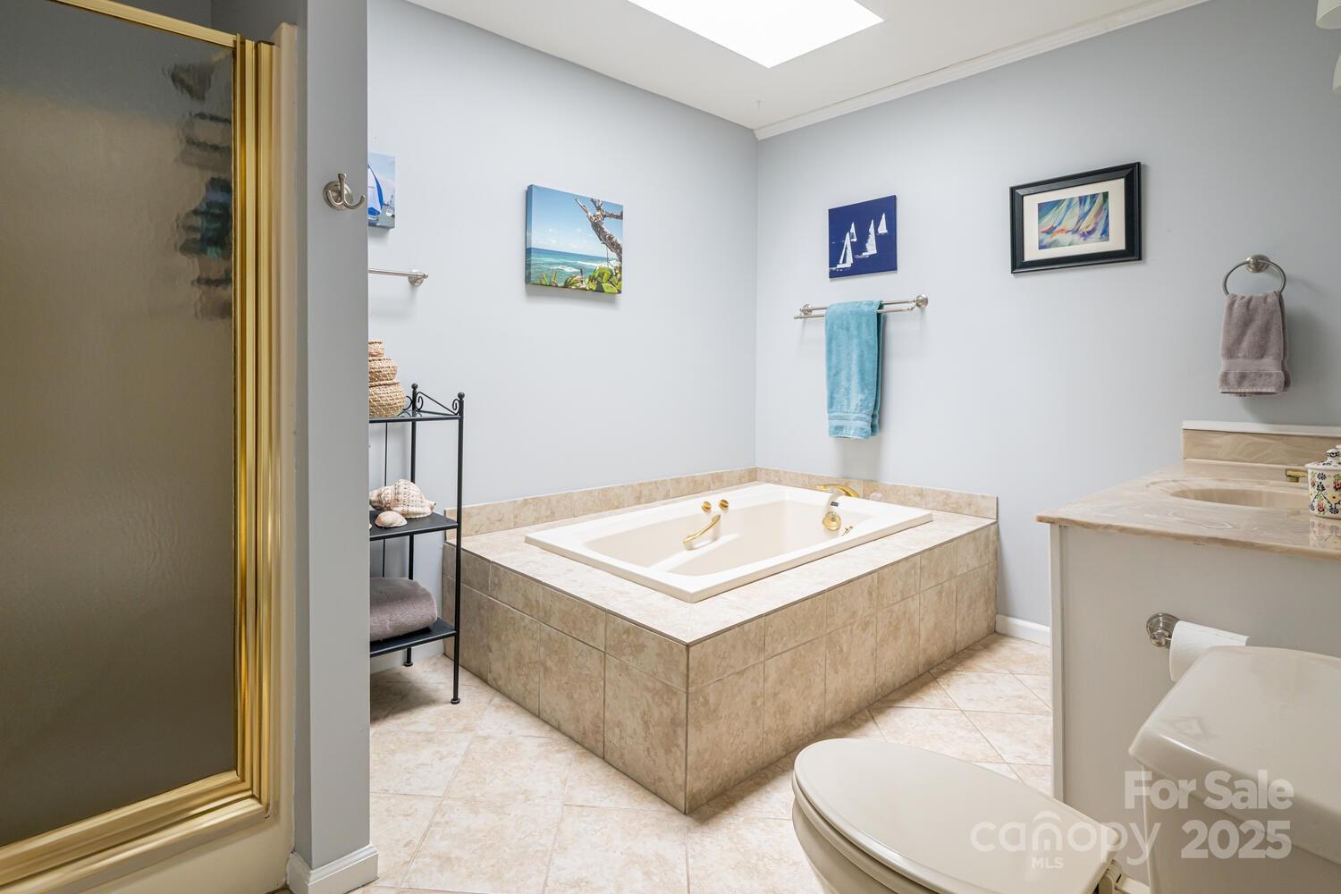 21 Mann Road Asheville, NC 28805 - Photo 24 of 36 a white tub sitting next to a bathroom sink