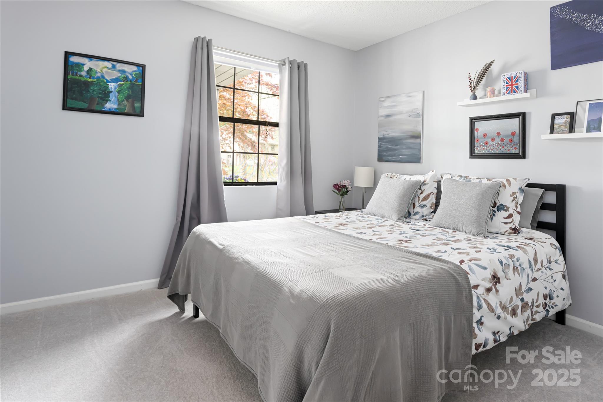 21 Mann Road Asheville, NC 28805 - Photo 27 of 36 a bedroom with a bed and a window