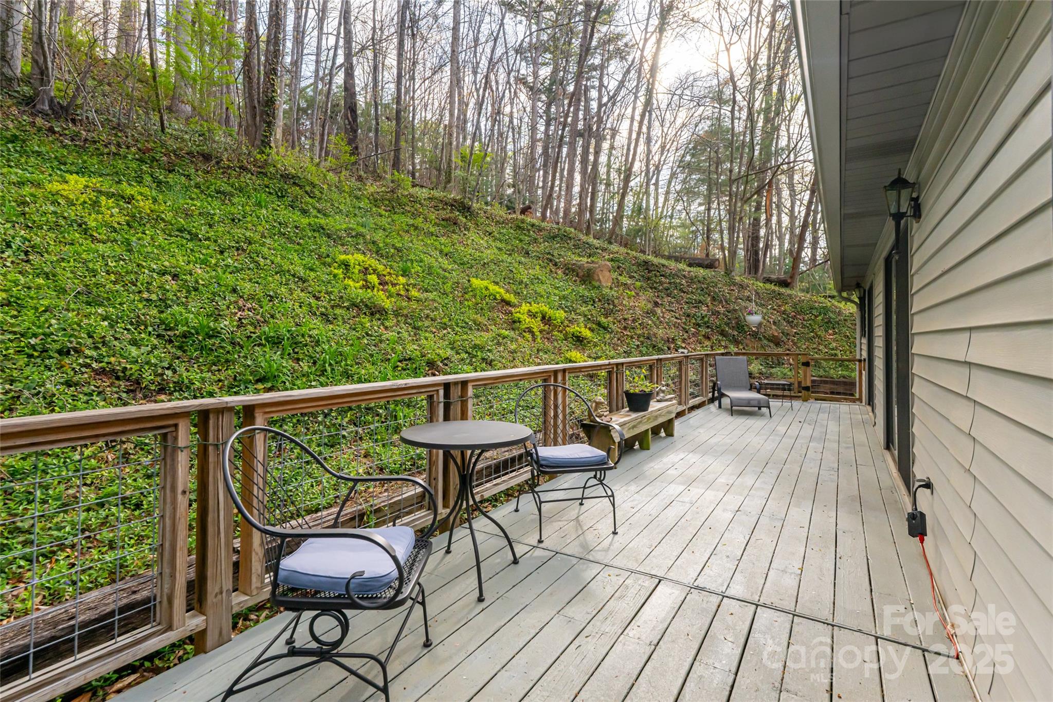 21 Mann Road Asheville, NC 28805 - Photo 29 of 36 a view of balcony with wooden floor and outdoor seating