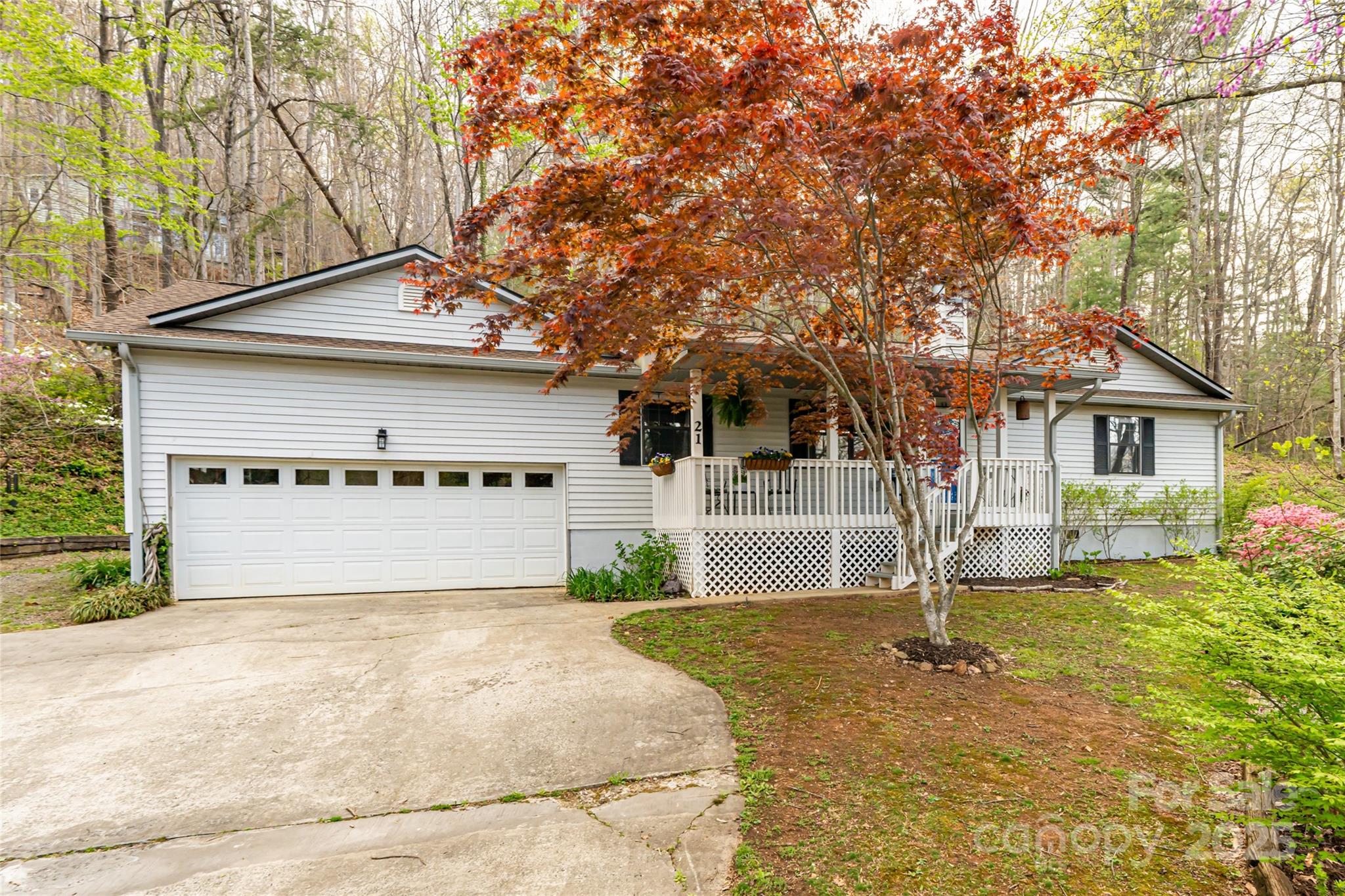 21 Mann Road Asheville, NC 28805 - Photo 36 of 36 a front view of a house with a yard and garage