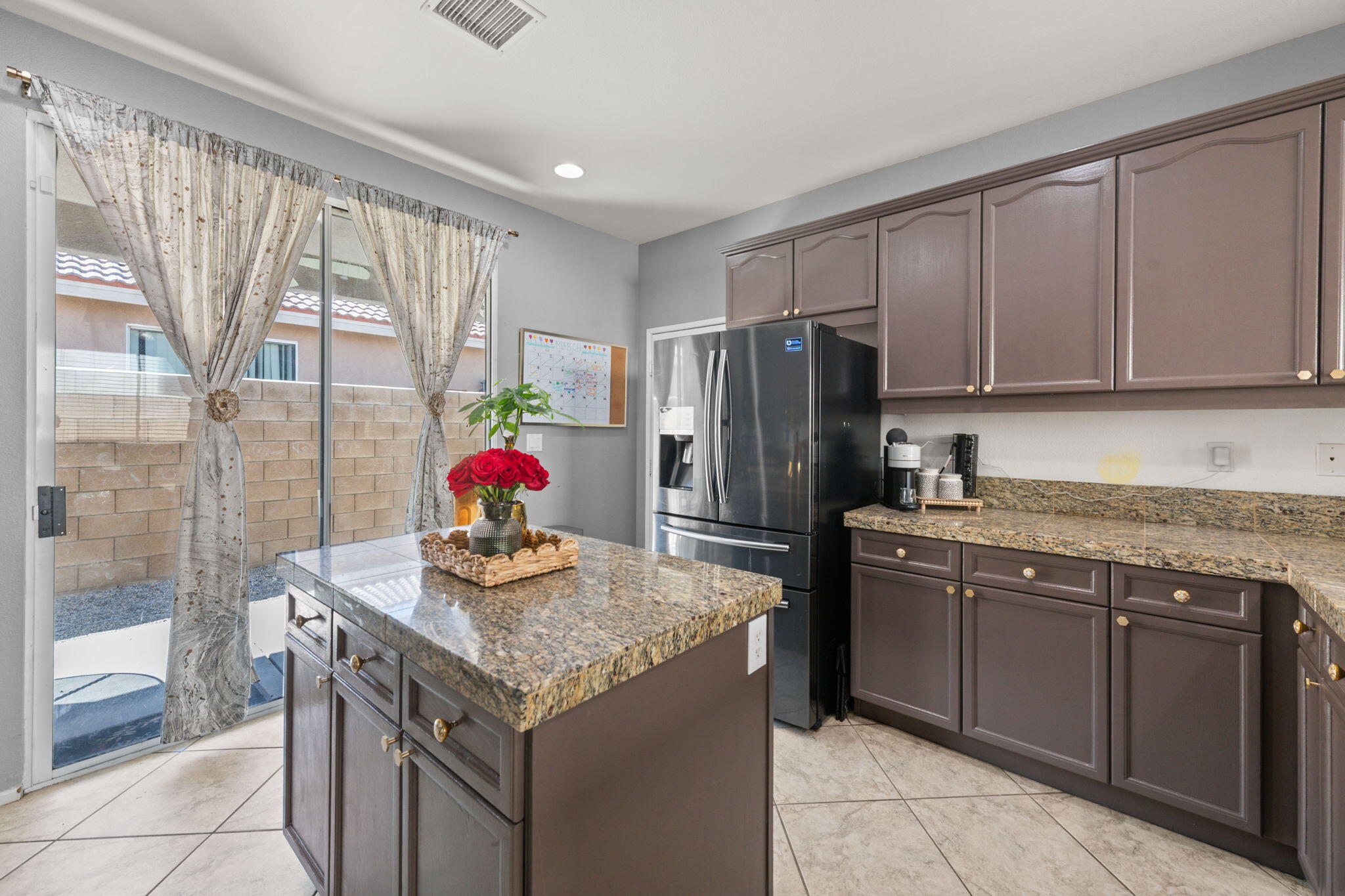 46450 Calle Raphael Indio, CA 92201 - Photo 11 of 29 a kitchen with stainless steel appliances granite countertop a sink stove and refrigerator