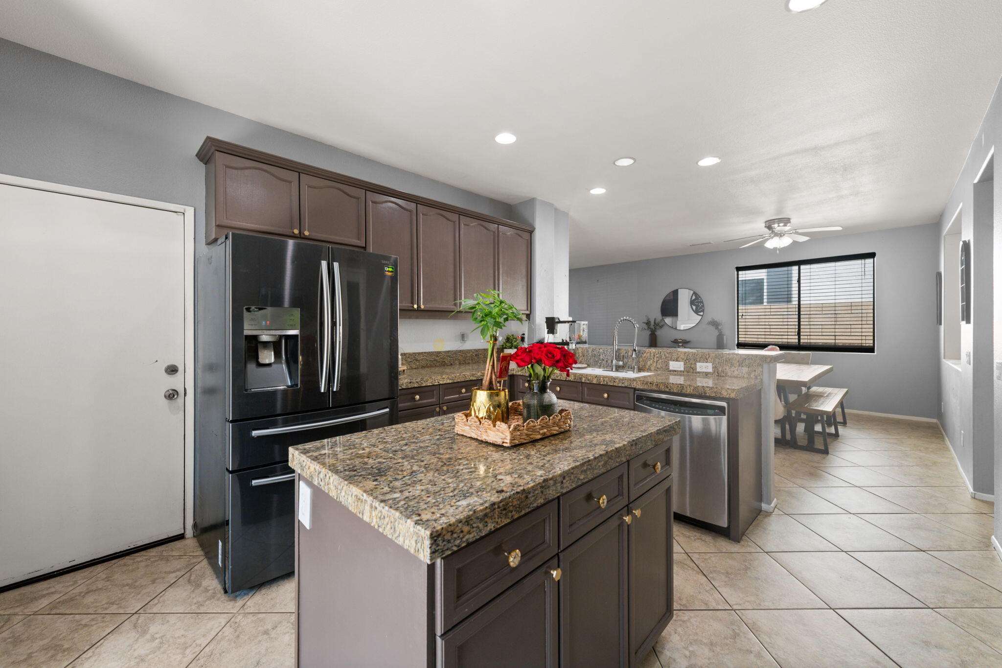46450 Calle Raphael Indio, CA 92201 - Photo 14 of 29 a kitchen with stainless steel appliances granite countertop a sink and a refrigerator