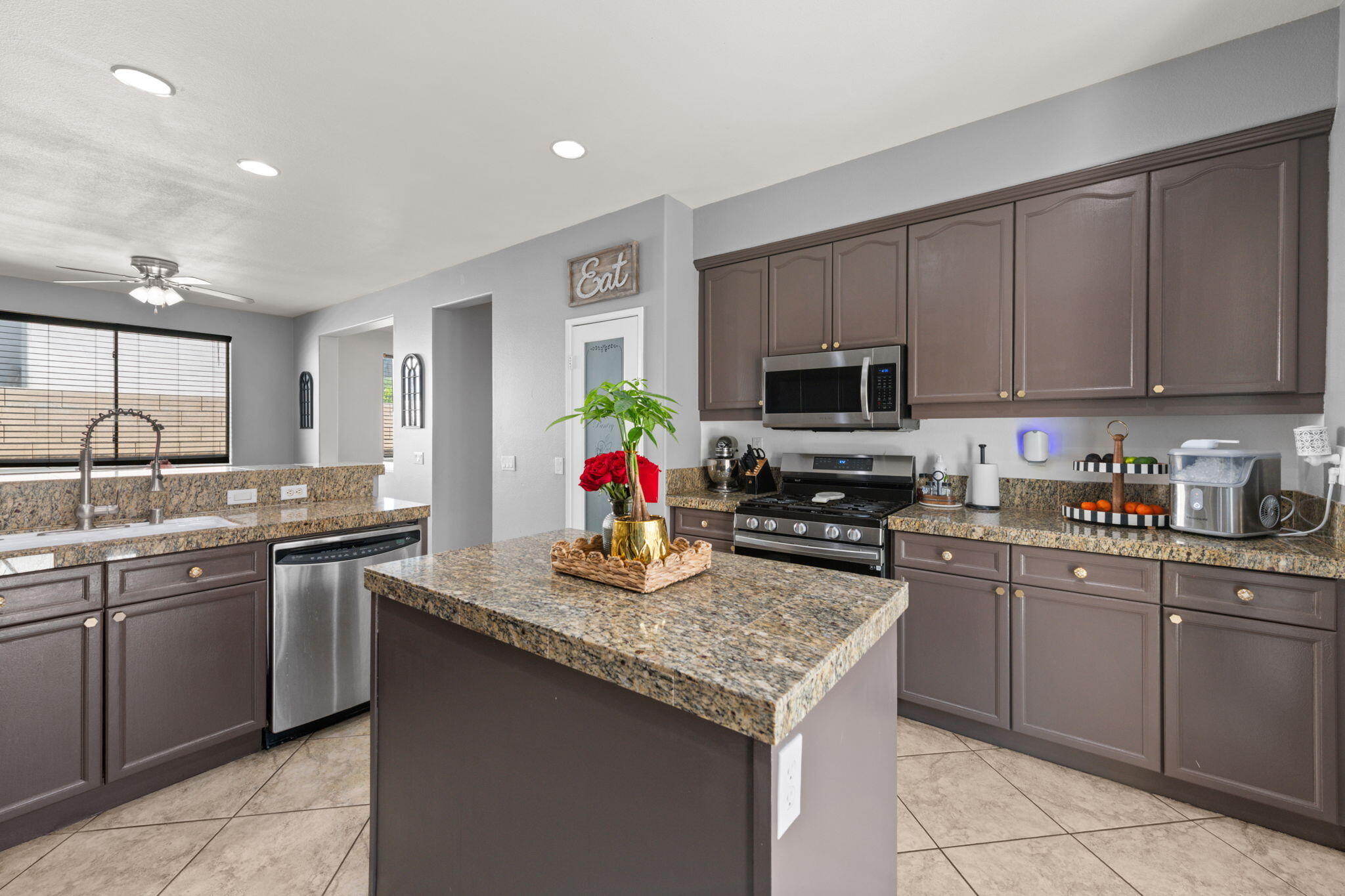 46450 Calle Raphael Indio, CA 92201 - Photo 15 of 29 a kitchen with a sink stove and microwave
