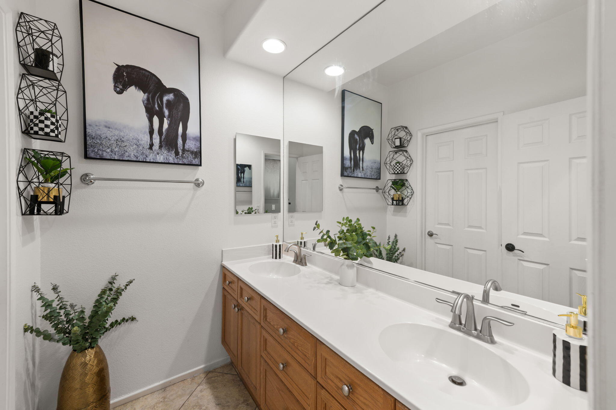 46450 Calle Raphael Indio, CA 92201 - Photo 23 of 29 a bathroom with a double vanity sink and a mirror