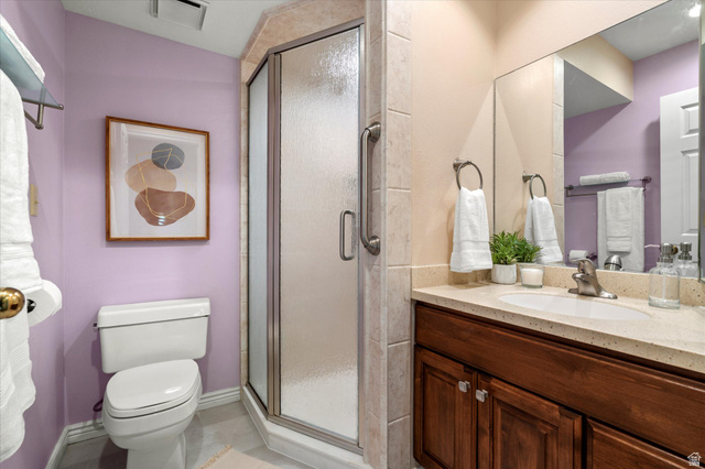 888 East 6895 South Midvale, UT 84047 - Photo 17 of 54 Functional bathroom with a walk-in shower, solid-surface vanity, and well-lit mirror, providing a clean and practical layout.