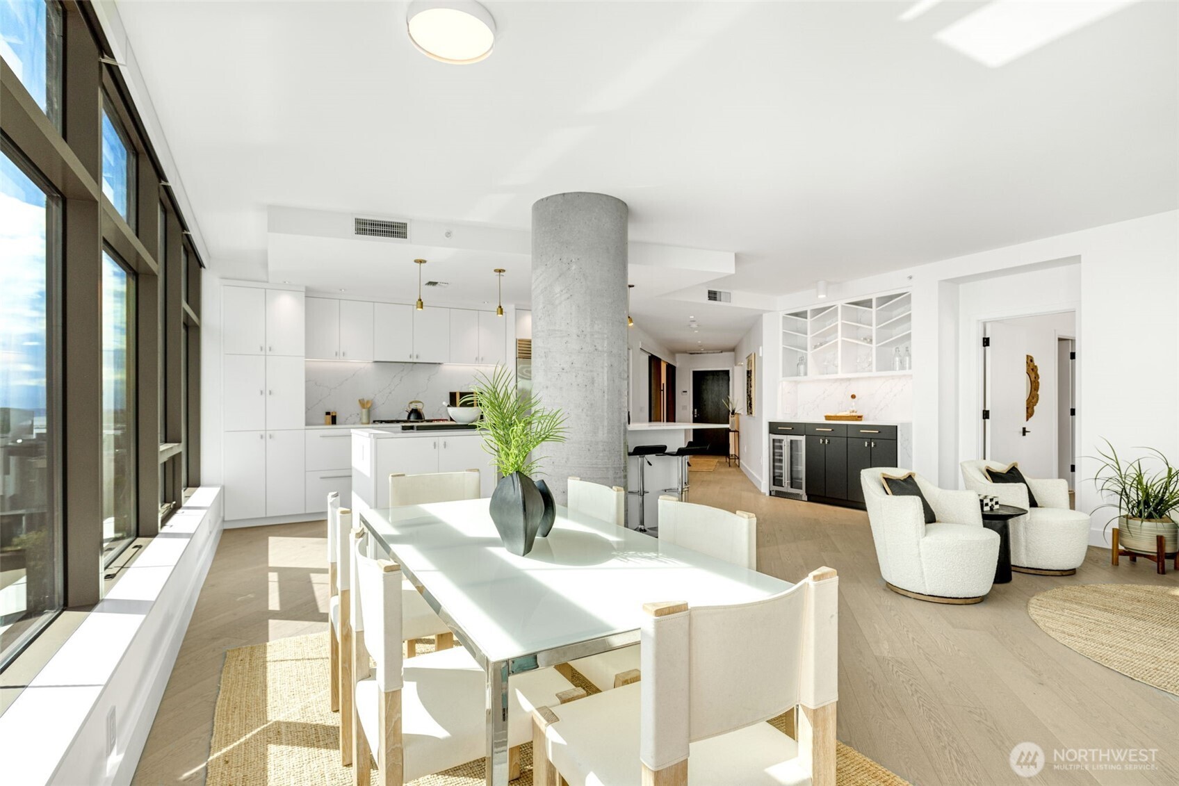 2033 2nd Avenue, Unit 1111 Seattle, WA 98121 - Photo 13 of 40 a view of a dining room with furniture and a large window