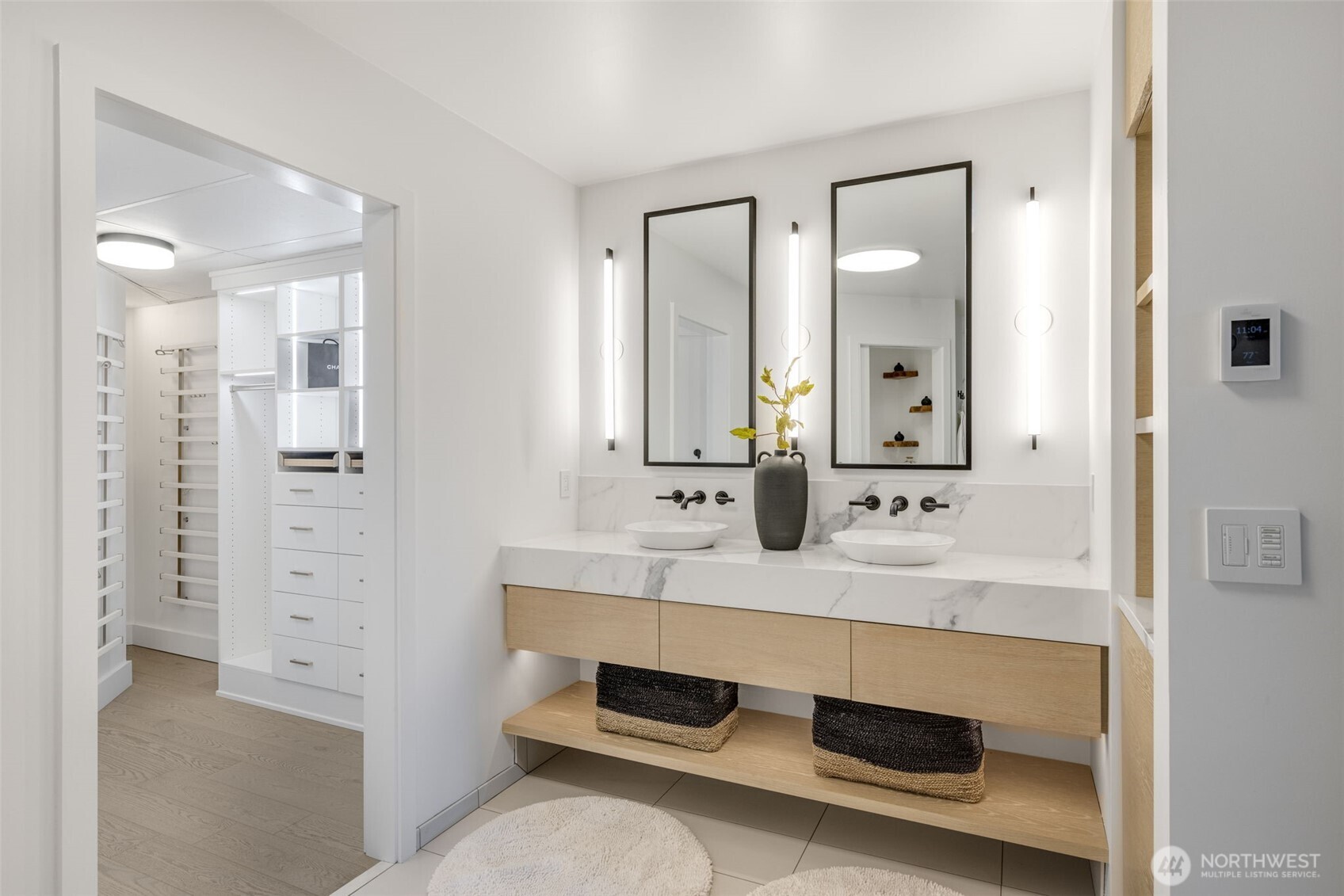 2033 2nd Avenue, Unit 1111 Seattle, WA 98121 - Photo 16 of 40 a bathroom with a sink and a mirror