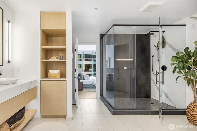 a bathroom with a shower and a sink