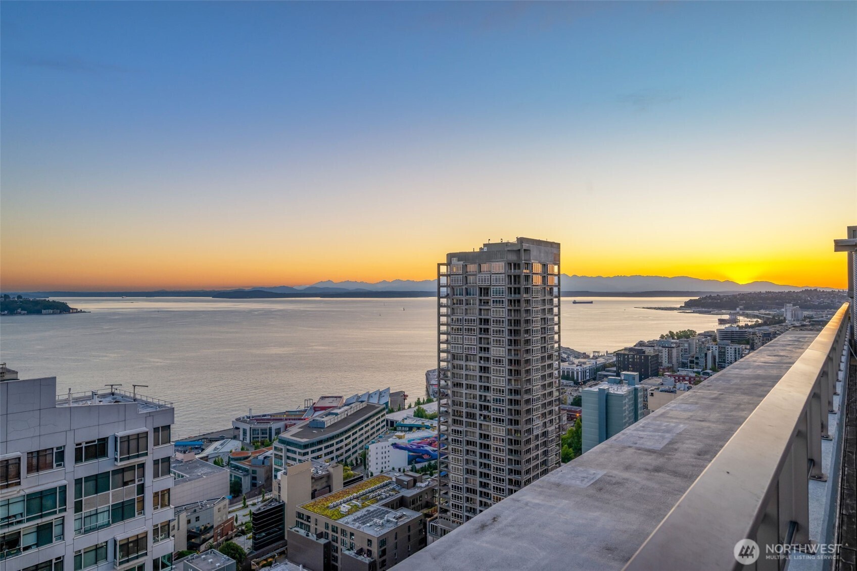 2033 2nd Avenue, Unit 1111 Seattle, WA 98121 - Photo 30 of 40 a view of building with ocean view