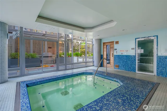 a living room with lots of furniture and a chandelier