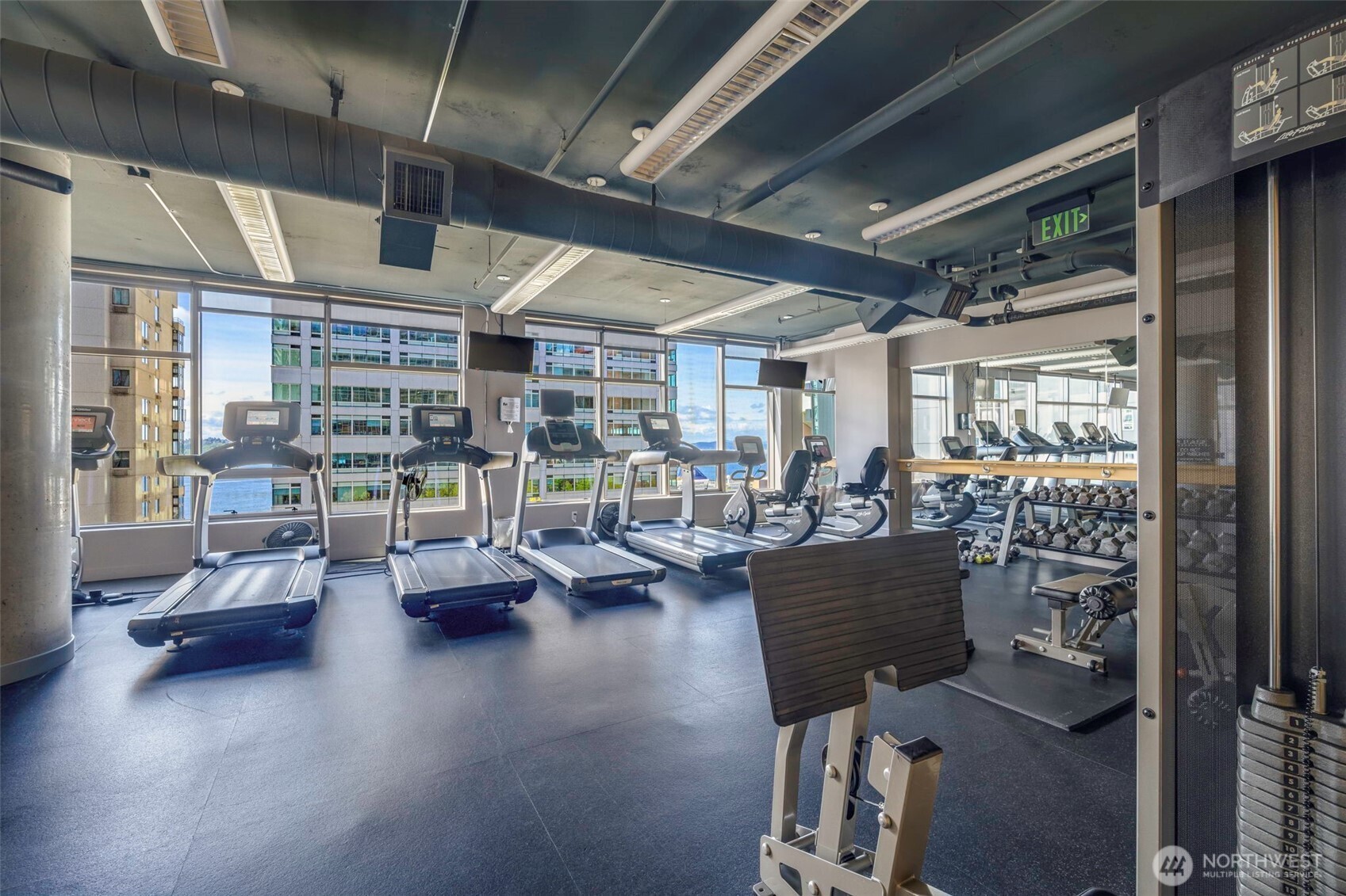2033 2nd Avenue, Unit 1111 Seattle, WA 98121 - Photo 36 of 40 a living room with lots of furniture and a chandelier