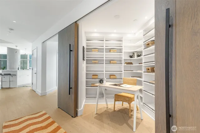 a view of walk in closet with empty racks