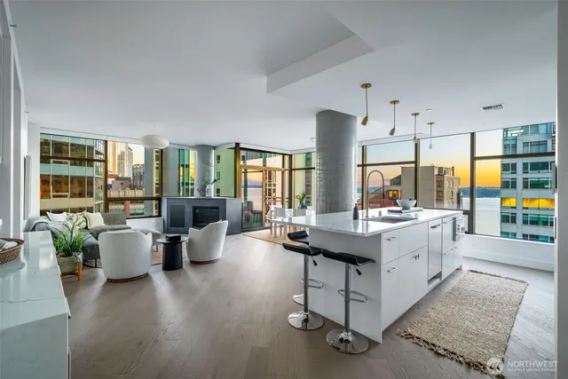 a kitchen with counter top space and living room