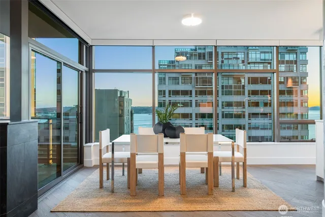a view of a dining room with furniture window and wooden floor