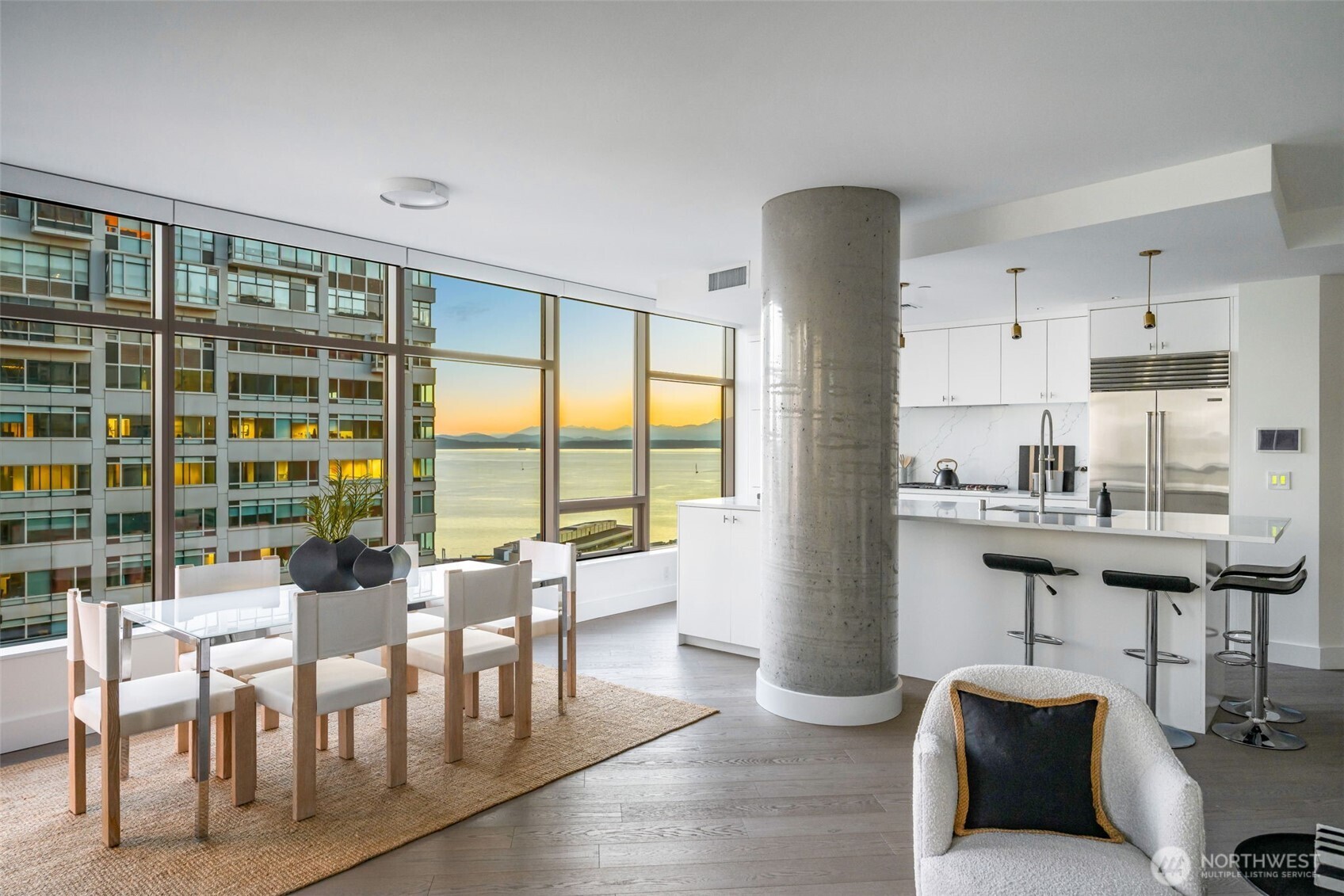 2033 2nd Avenue, Unit 1111 Seattle, WA 98121 - Photo 9 of 40 a living room with furniture and a large window