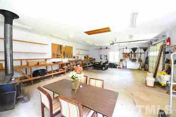 8214 Johnson Mill Road Bahama, NC 27503 - Photo 22 of 30 a room with lots of appliances and furniture