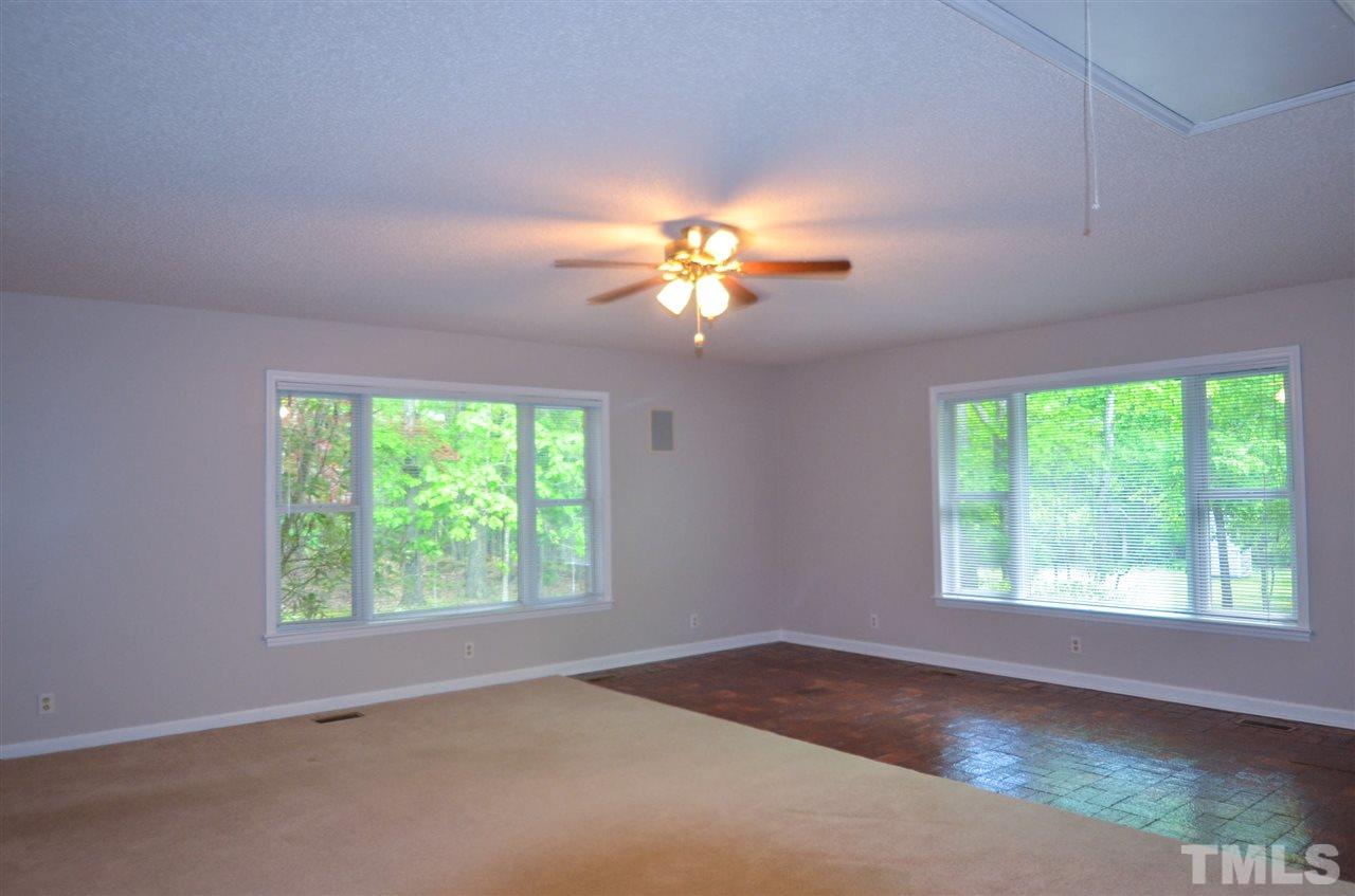 8214 Johnson Mill Road Bahama, NC 27503 - Photo 8 of 30 a view of an empty room with a window