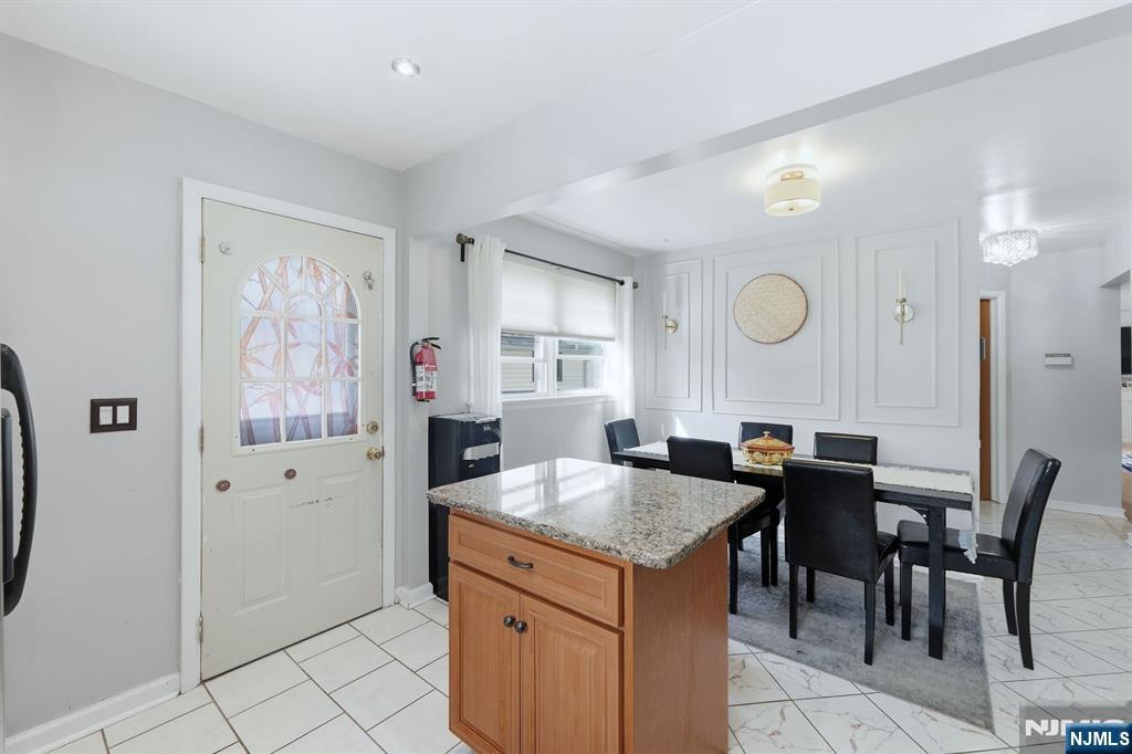 39 Voorhees Street Teaneck, NJ 07666 - Photo 11 of 47 a view of kitchen island with granite countertop furniture and a sink