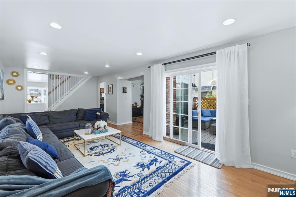 39 Voorhees Street Teaneck, NJ 07666 - Photo 12 of 47 a living room with furniture and a table