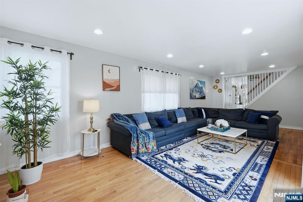 39 Voorhees Street Teaneck, NJ 07666 - Photo 13 of 47 a living room with furniture and a potted plant