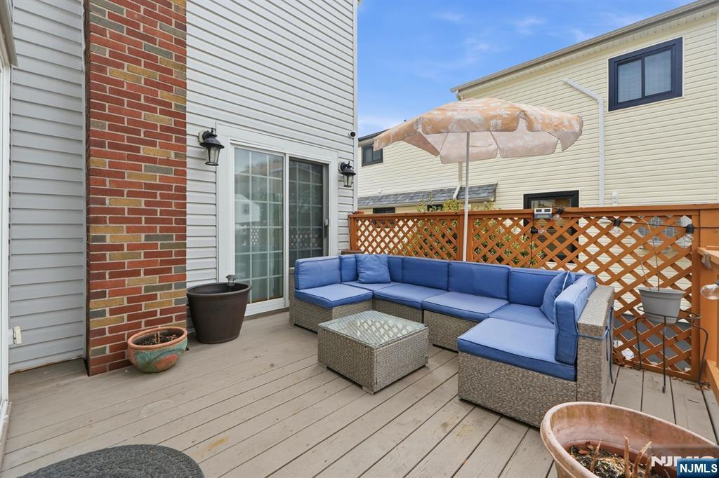 39 Voorhees Street Teaneck, NJ 07666 - Photo 17 of 47 a view of a patio with couches and a potted plant on a patio