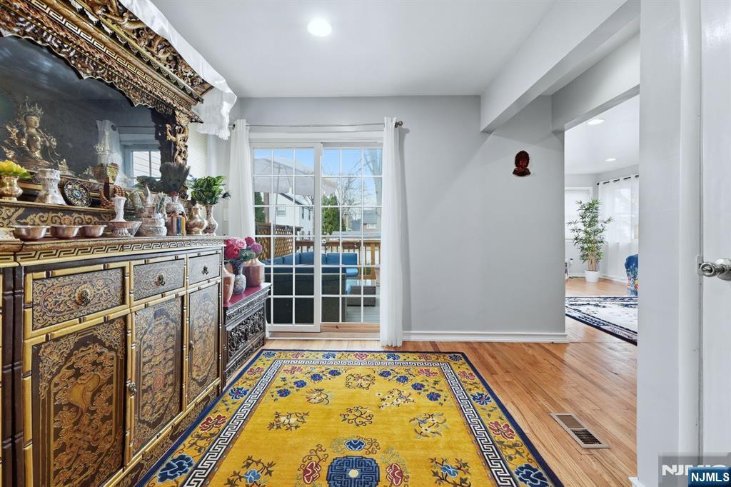 39 Voorhees Street Teaneck, NJ 07666 - Photo 18 of 47 a view of an entryway with wooden floor